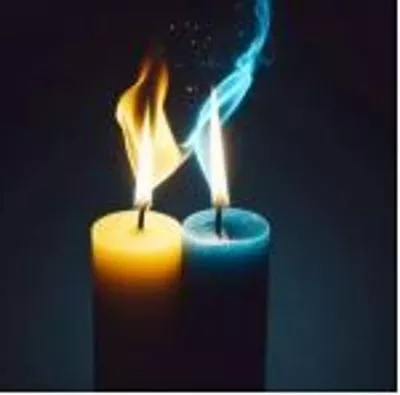 Two candles with contrasting colors, one yellow and one blue, with their flames leaning towards each other in a symbolic representation of unity and connection.